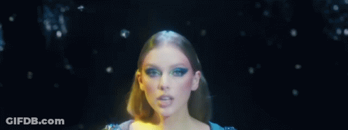 Woman In Blue Dress In Dark Room GIF