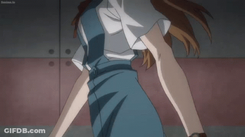 Woman In Blue Dress In Front Of Red Wall Boanime.tv GIF