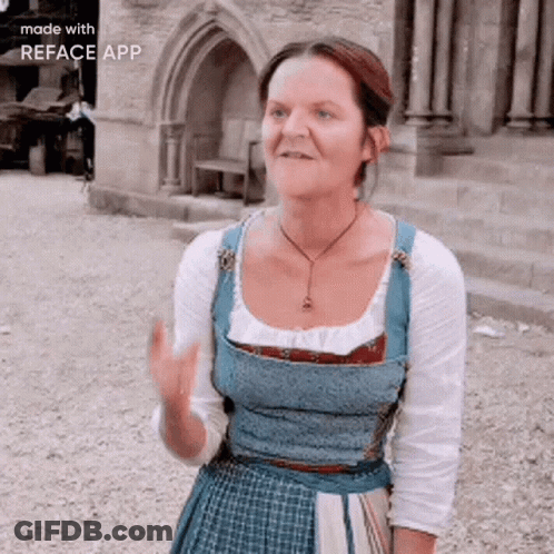 Woman In Blue Dress In Front Of Stone Building GIF