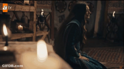 Woman In Blue Dress In Front Of TV GIF