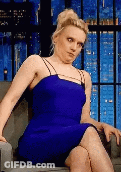 Woman In Blue Dress Making Funny Face GIF