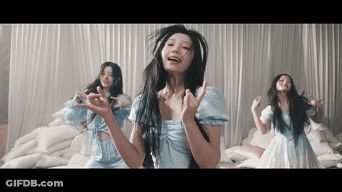 Woman In Blue Dress Making Funny Face GIF