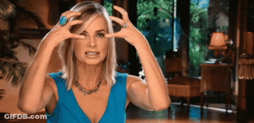 Woman In Blue Dress Making Funny Face GIF