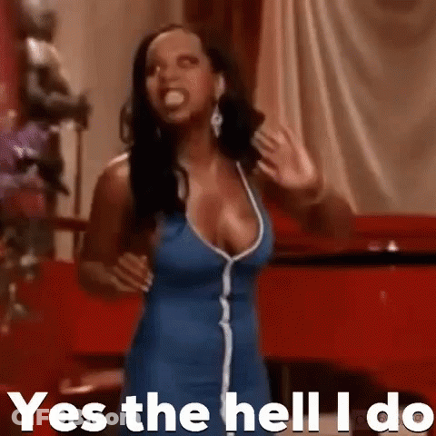 Woman In Blue Dress Making Funny Face GIF