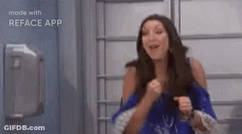 Woman In Blue Dress Making Funny Face GIF