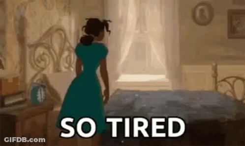 Woman In Blue Dress Next To Bed GIF