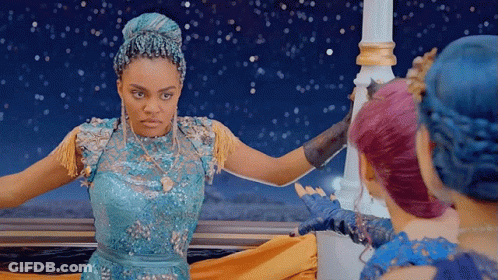 Woman In Blue Dress Next To Two Others GIF