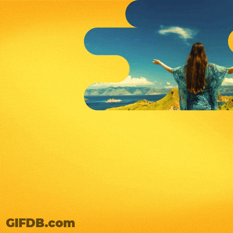 Woman In Blue Dress Overlooking Ocean Arms Outstretched GIF