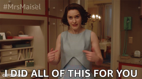 Woman In Blue Dress Pointing At Herself GIF