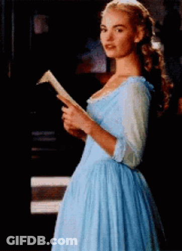 Woman In Blue Dress Reading A Book GIF