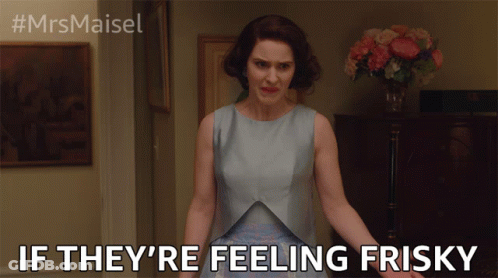 Woman In Blue Dress Saying Feeling Frisky GIF