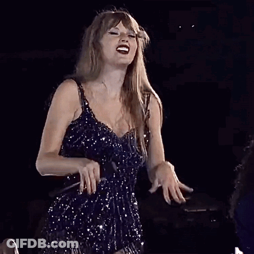 Woman In Blue Dress Singing Into Microphone GIF