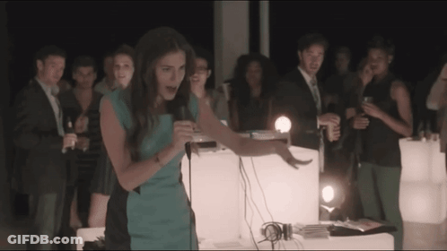 Woman In Blue Dress Singing Into Microphone GIF