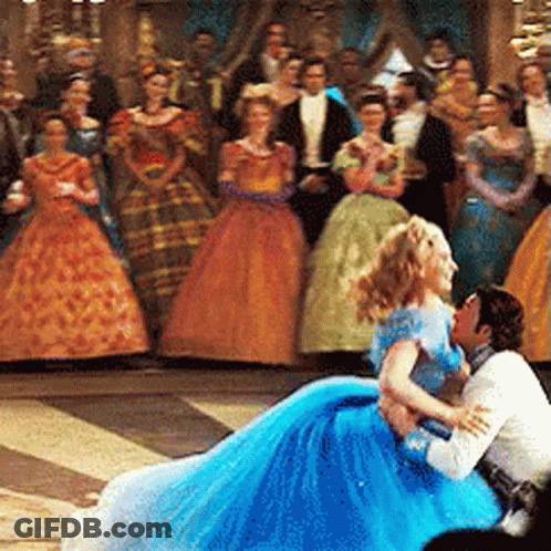 Woman In Blue Dress Sitting On Man's Lap GIF