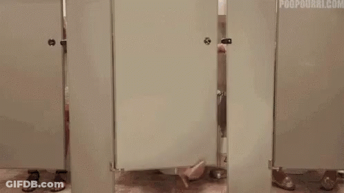 Woman In Blue Dress Sitting On Toilet In Public Restroom GIF