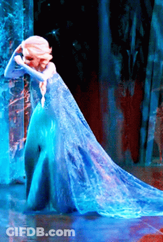 Woman In Blue Dress Standing By Window GIF