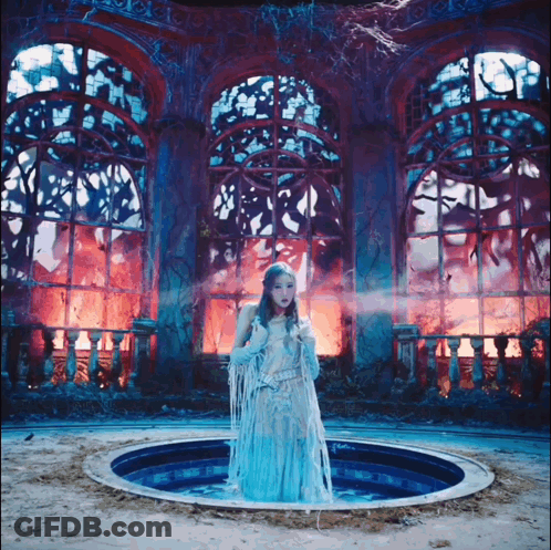 Woman In Blue Dress Standing In Pool GIF