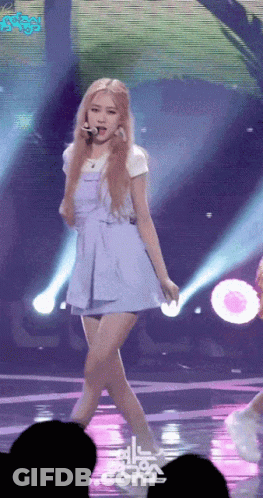 Woman In Blue Dress Standing On Stage GIF