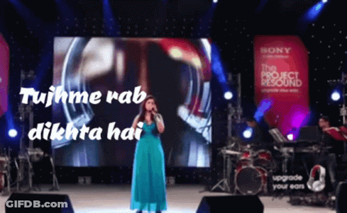 Woman In Blue Dress Standing On Stairs GIF