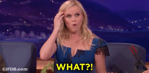 Woman In Blue Dress Surprised Holding Head GIF