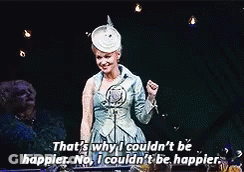 Woman In Blue Dress Talking Into Microphone GIF