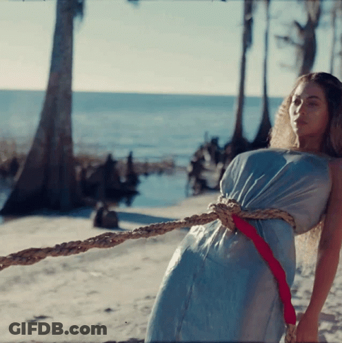Woman In Blue Dress Tied With Rope GIF