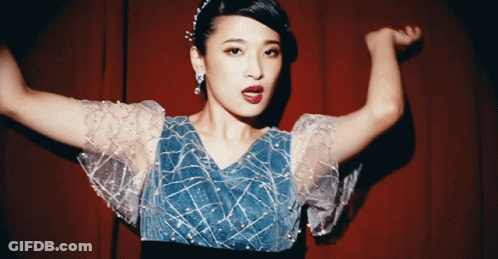 Woman In Blue Dress With White Sleeves GIF