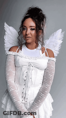 Woman In Blue Dress With White Wings Flying Through Clouds GIF
