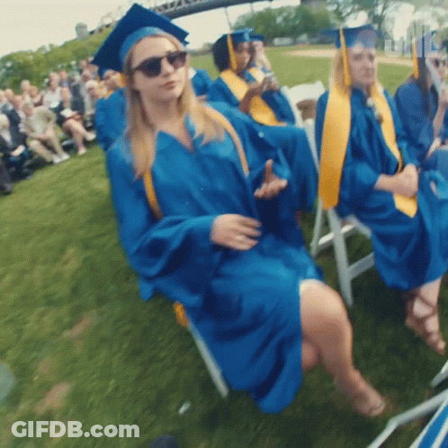 Woman In Blue Graduation Cap And Gown GIF