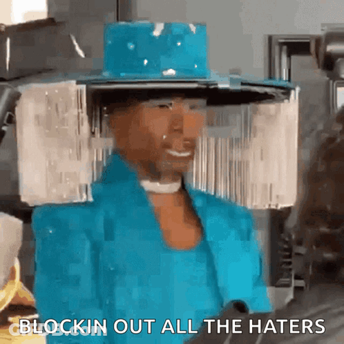 Woman In Blue Hat And Jacket Saying Blockin Out All The Haters GIF
