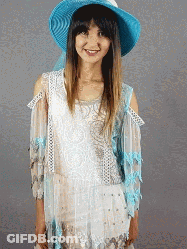 Woman In Blue Hat And White Top Smiling GIF