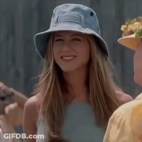 Woman In Blue Hat Smiling At Camera GIF
