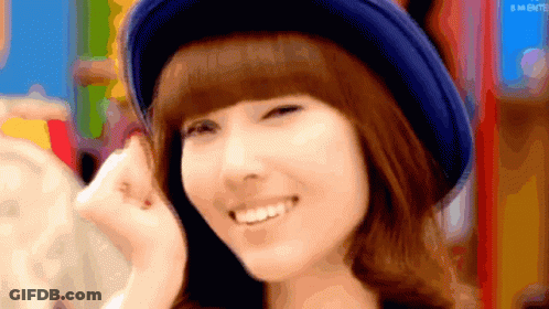 Woman In Blue Hat Smiling With GM Letters GIF