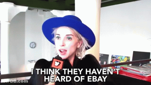 Woman In Blue Hat Talking Into Microphone GIF