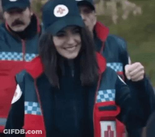Woman In Blue Hat With Red Cross GIF