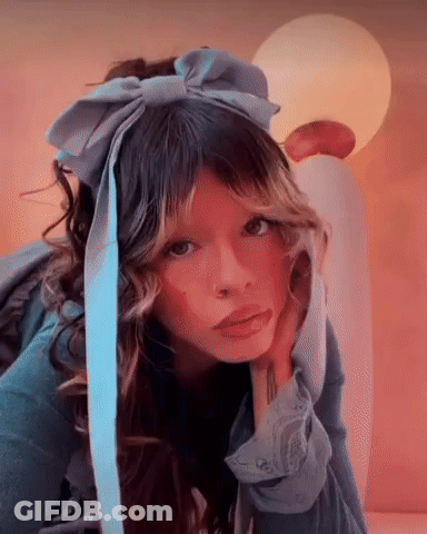 Woman In Blue Headband With Bow GIF