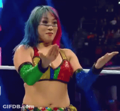 Woman In Blue Holding Wrestling Championship Belt GIF