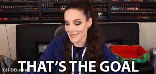 Woman In Blue Hoodie Smiling Says Goal GIF