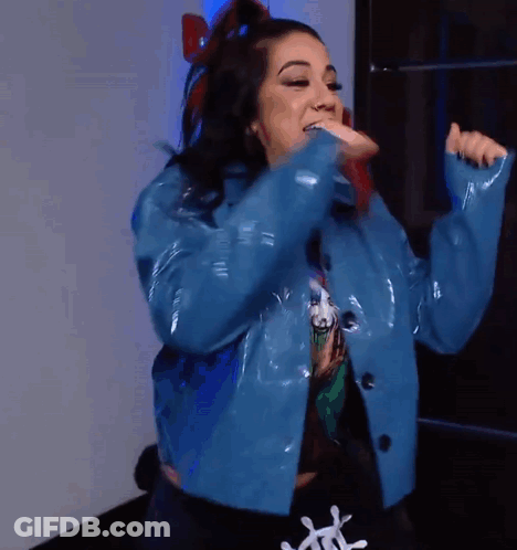 Woman In Blue Jacket And Black T-Shirt With Letter L GIF