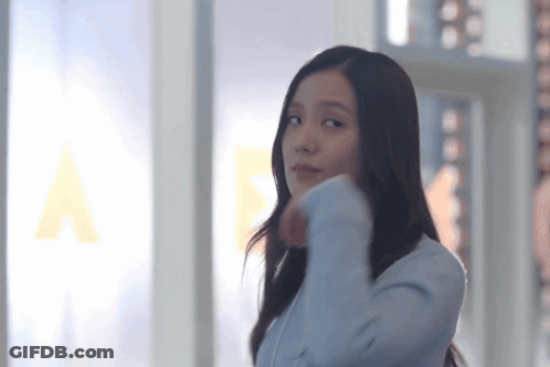 Woman In Blue Jacket At Window GIF
