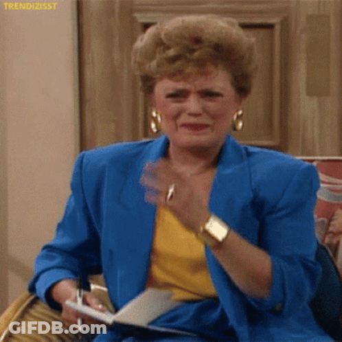 Woman In Blue Jacket Crying Holding Pen And Paper GIF