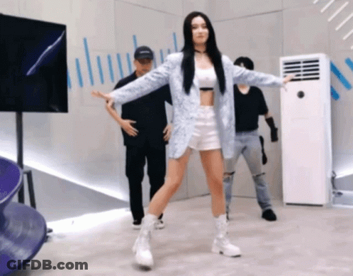 Woman In Blue Jacket Dancing In Front Of Air Conditioner GIF