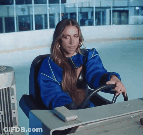 Woman In Blue Jacket Driving On Ice GIF