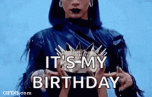 Woman In Blue Jacket Holding Birthday Cake GIF