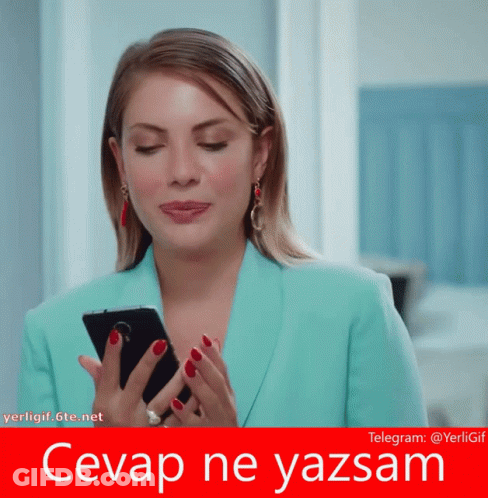 Woman In Blue Jacket Holding Phone Saying Cevap Ne Yazsam GIF