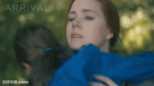 Woman In Blue Jacket Hugging Girl With Arrival GIF