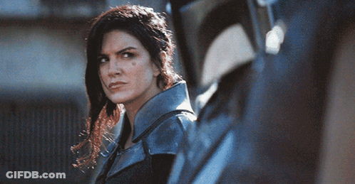 Woman In Blue Jacket Next To Man In Black Helmet GIF
