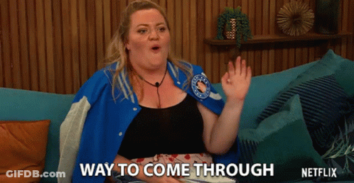 Woman In Blue Jacket Sitting On Couch Says Way To Come Through GIF