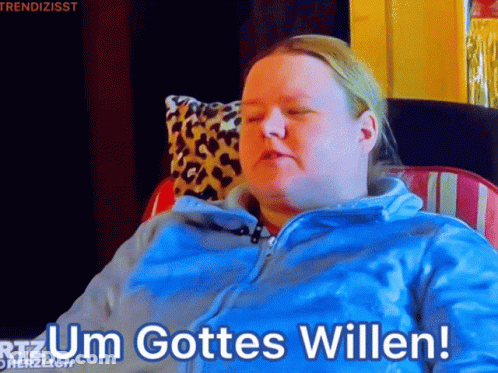 Woman In Blue Jacket Sitting With Um Gottes Willen GIF