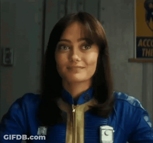 Woman In Blue Jacket Smiling At Account Them Sign GIF